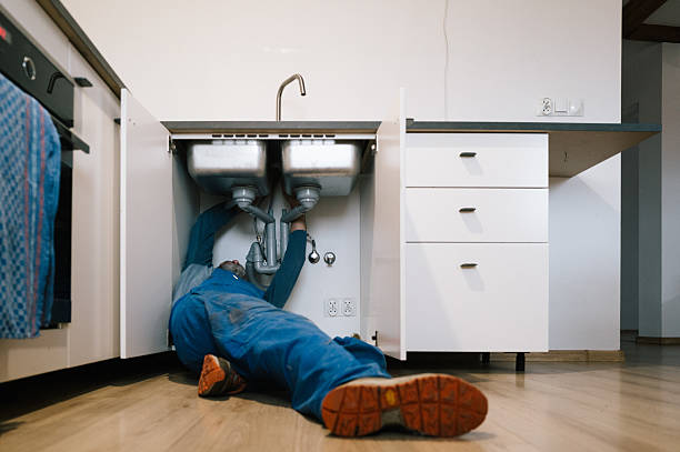 Professional Emergency Plumber technician working in Newtown, CT